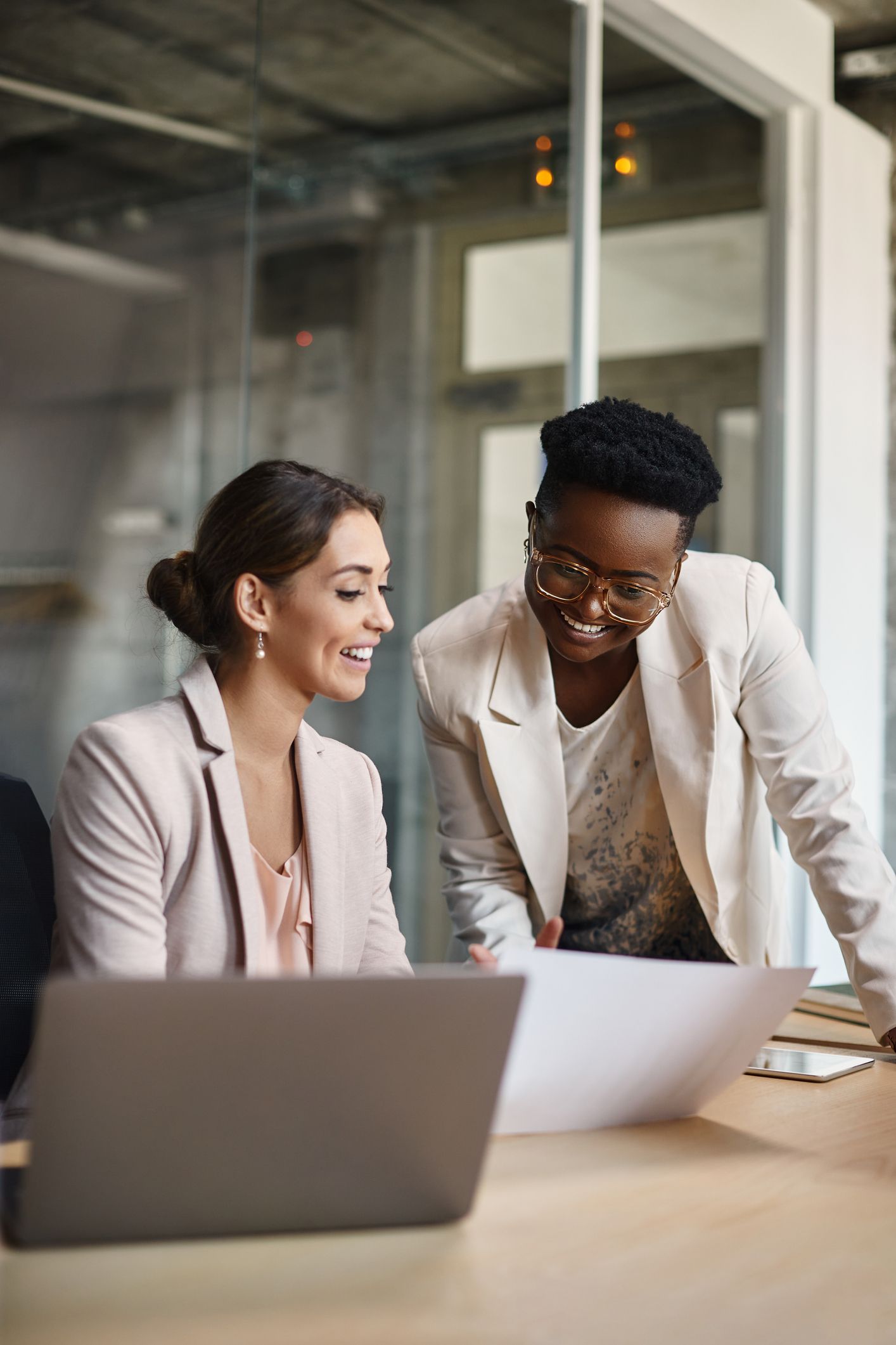 Happy Black Businesswoman And Her Colleague Working On New Ideas