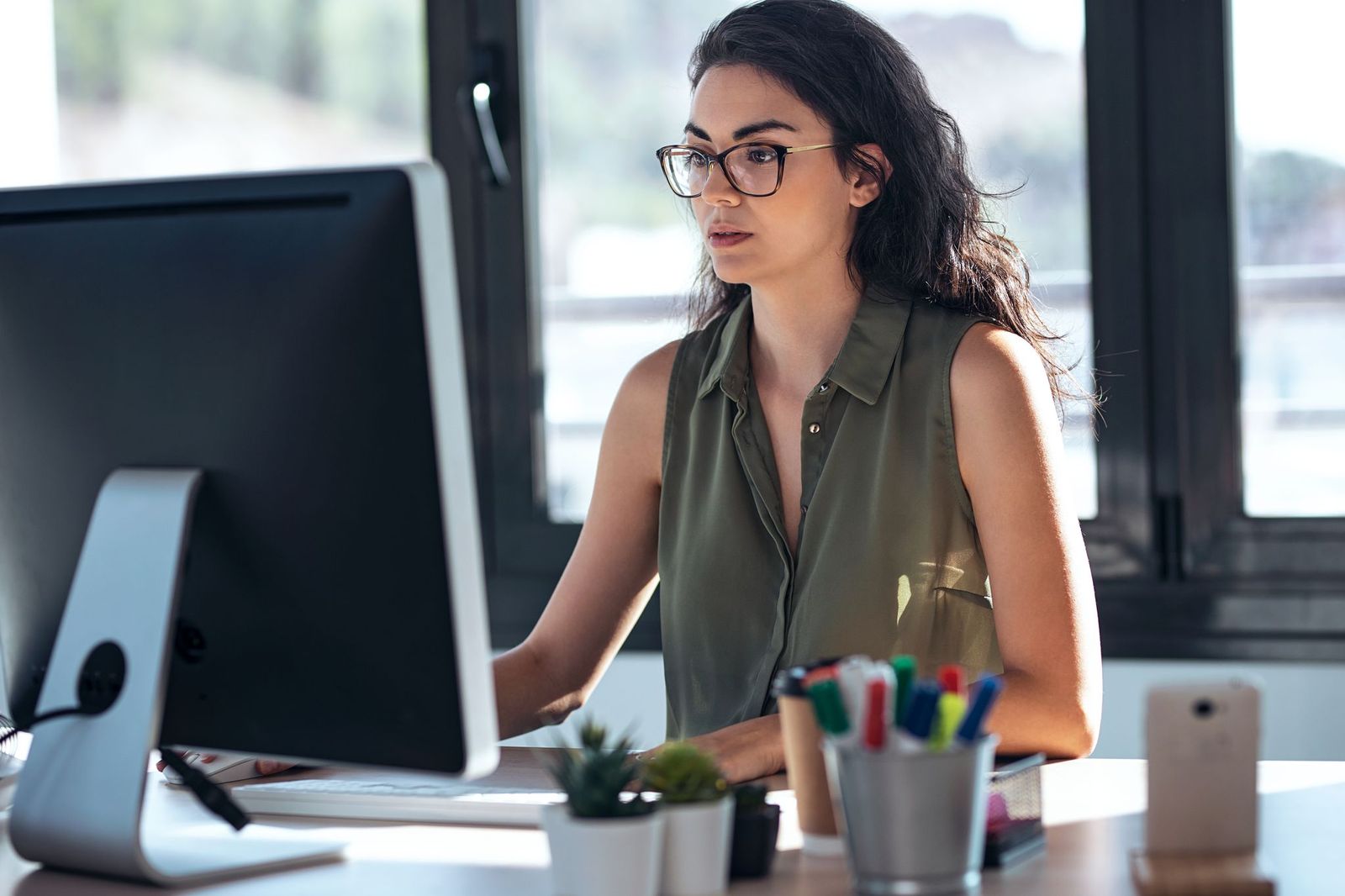 Woman Adding Bank Details To A Xero Invoice